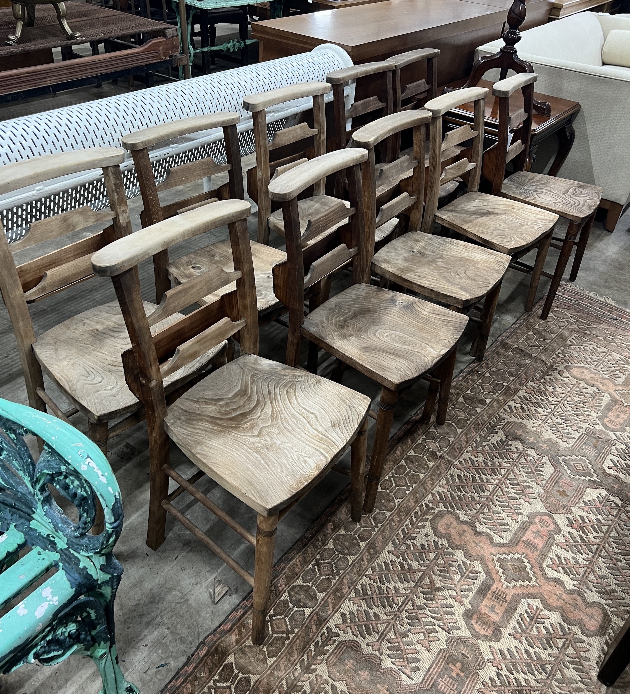 A set of ten elm and beech chapel chairs